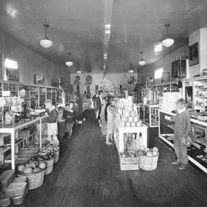 Black and white image of the interior of an Old Grocery Store.